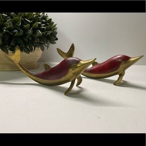Pair of vintage brass and leather dolphin figurines